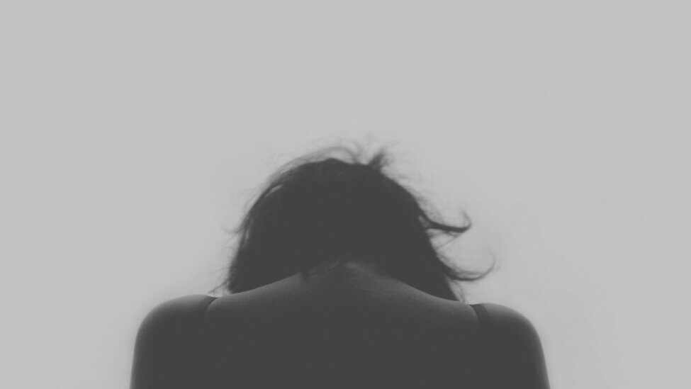 Black and White woman facing backwards with head down What is Gratitude?