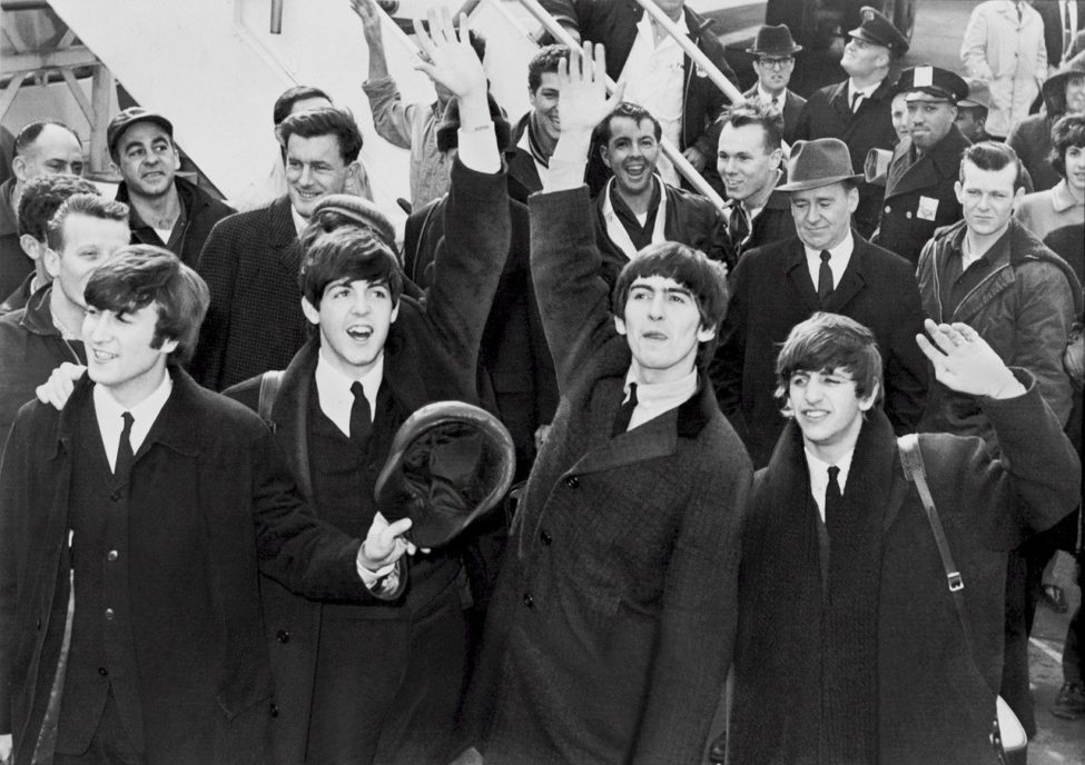 Black and white image of the Beatles in front of a crowd positive affirmations 
