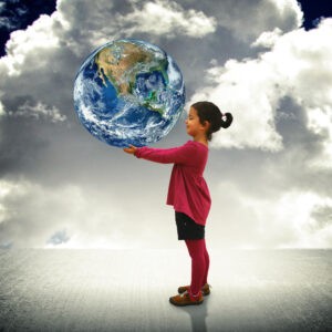 little girl holding a globe