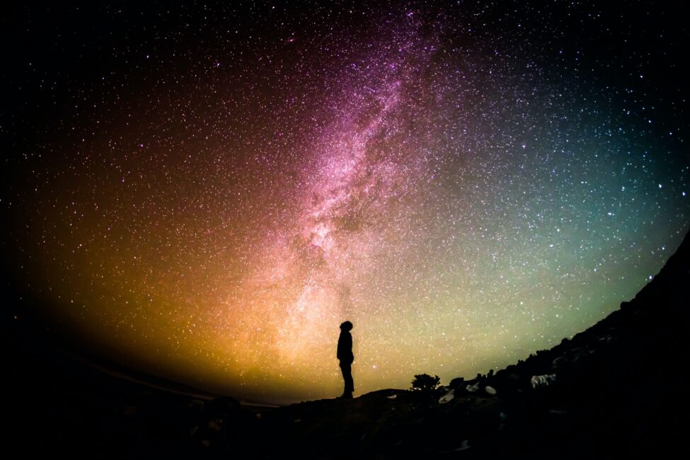 Person silhouetted in front of stars spiritual