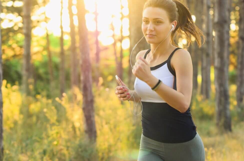 woman jogging in the woods good habits