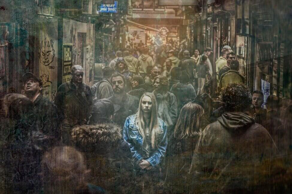 Women standing in a crowd looking lost and sad Life Coach or Counsellor