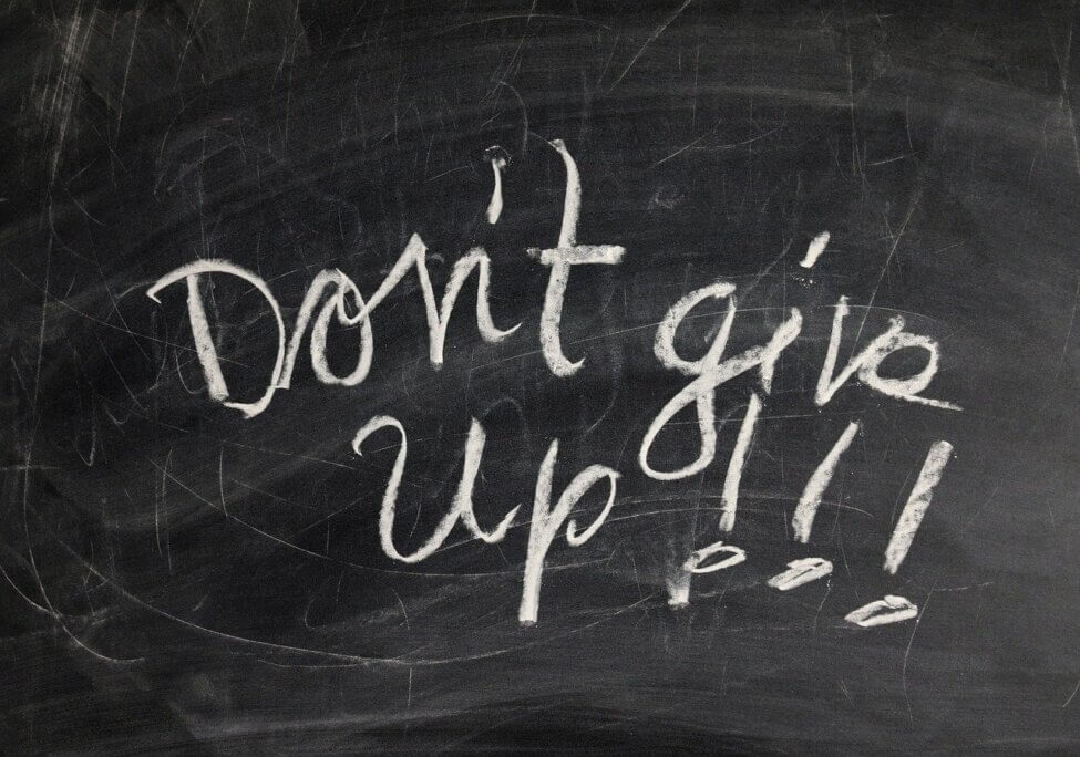 chalk board with "don't give up!" written on it fail forward
